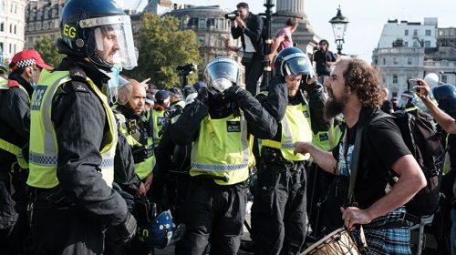 Group of police controlling riot