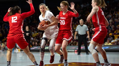 Women playing basketball