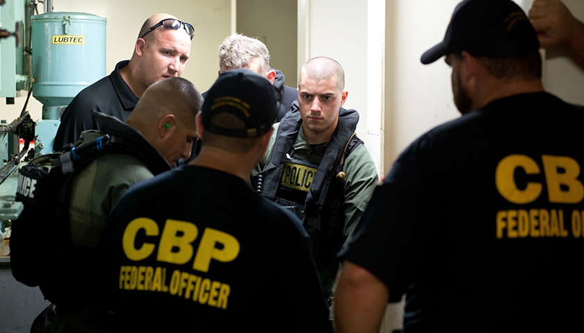 Members of Galveston County S.W.A.T. work with with Customs and Border Protection Agents during Maritime Tactical Operations Group vessel boarding training in the Houston Ship Channel, Aug. 23, 2016.