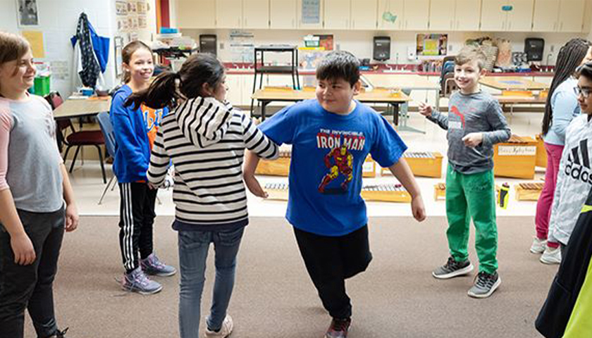 Students dancing in classroom