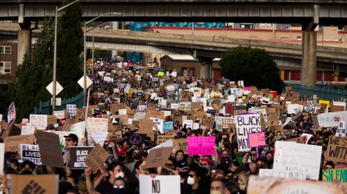 Crowd of people in the streets, protesting and Black Lives Matter movement