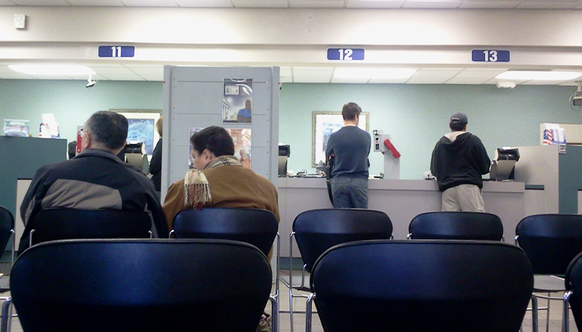 People in chairs at the DMV