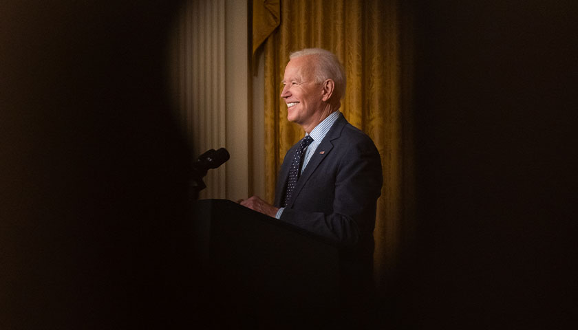 Joe Biden smiling at crowd