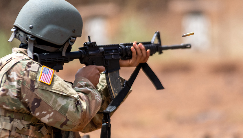U.S. Military member shooting an AR.