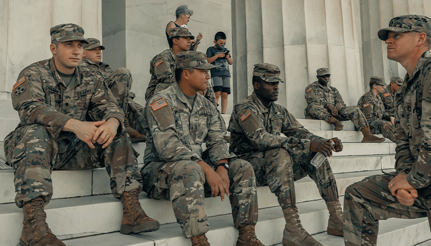 Military men in uniform, on the steps of the National Mall in Washington D.C.