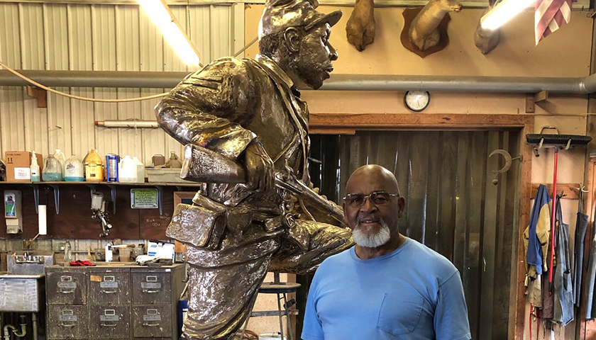 Man standing next to Joe Howard Statue to be put in Franklin, TN