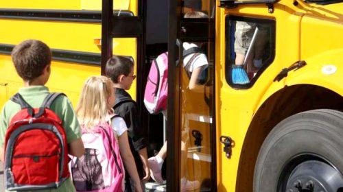 Kids getting on school bus
