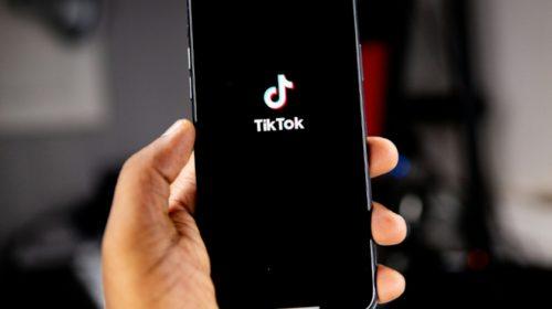 iPhone with TikTok app logo