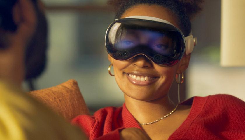 Woman wearing Apple Vision Pro goggles