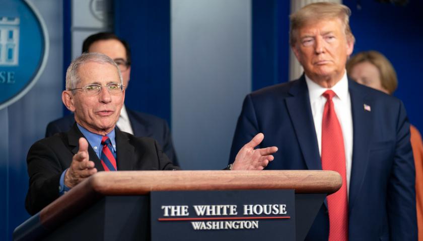 Anthony Fauci and Donald Trump at a White House press conference in 2020