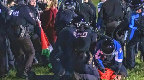 Police arresting campus protester