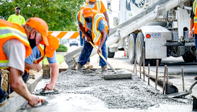 Workers laying concrete