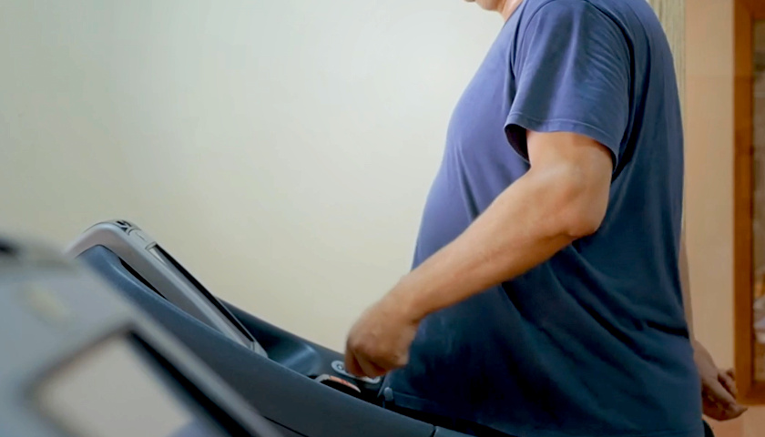Overweight man on a treadmill