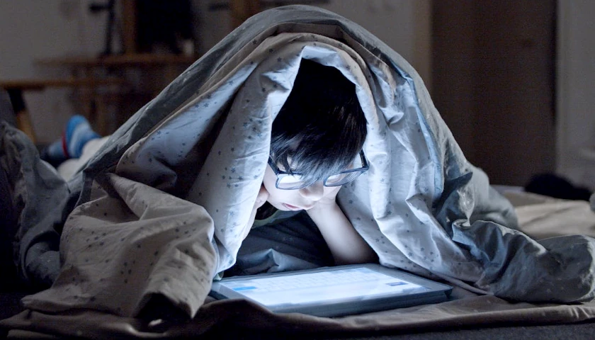 Kid on tablet