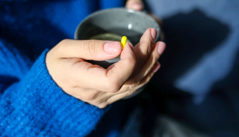 Pill and water