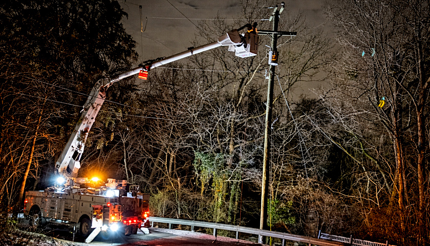 Lineman working on a power pole
