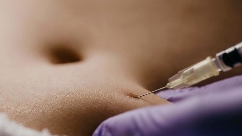 needle in stomach